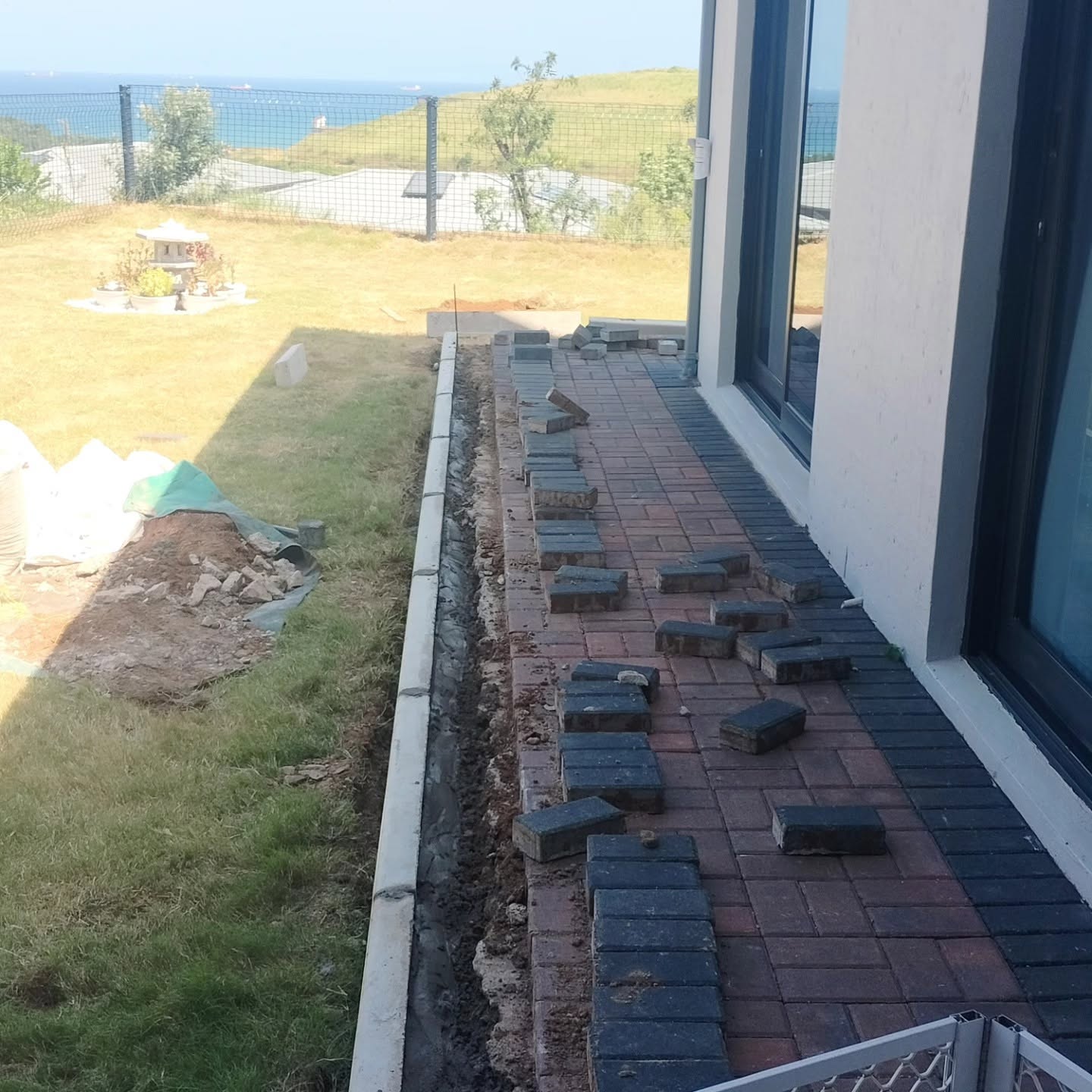 Brick retaining wall build in progress