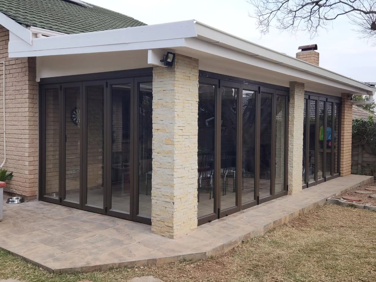 Completed roofing project with coastline backdrop, Durban North