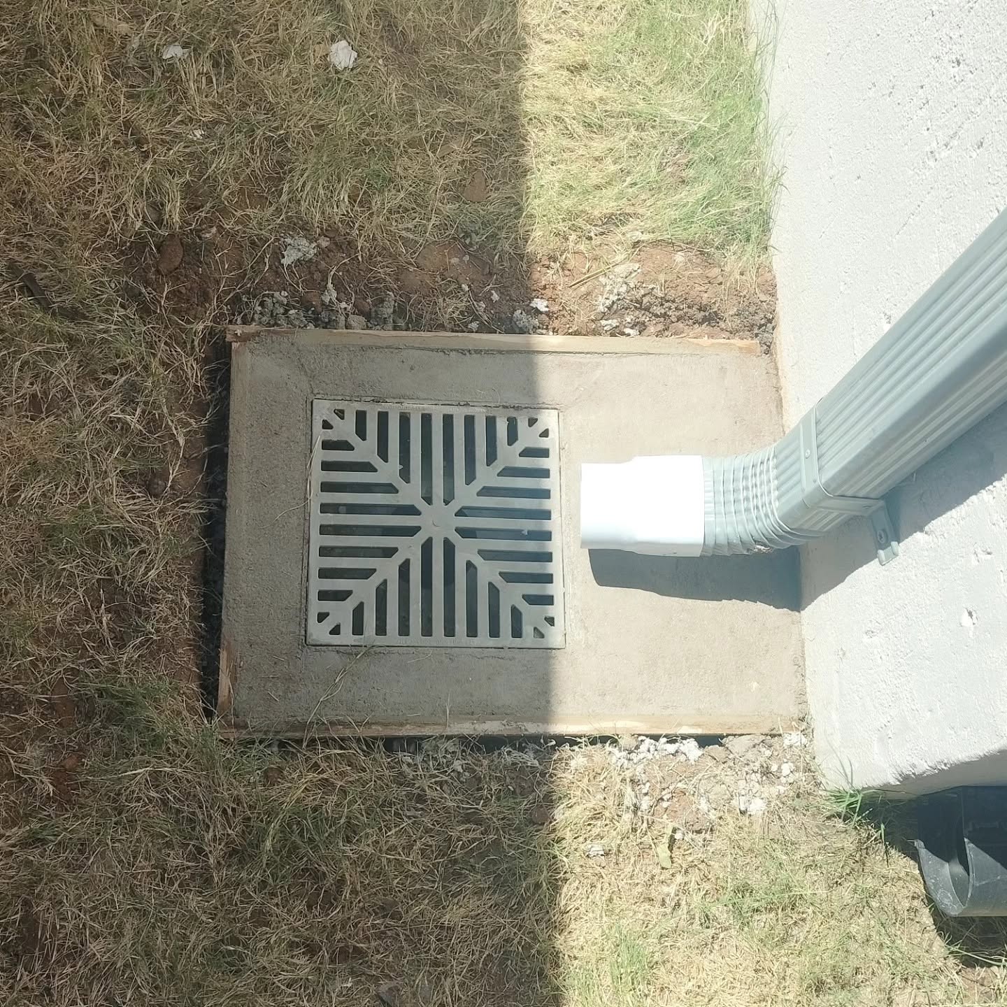 Herringbone paver detail near garage